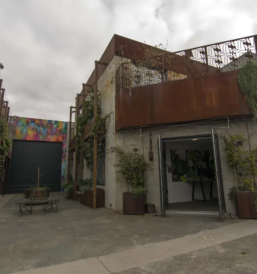 Bespoke laser cut corten steel features heavily in this build
