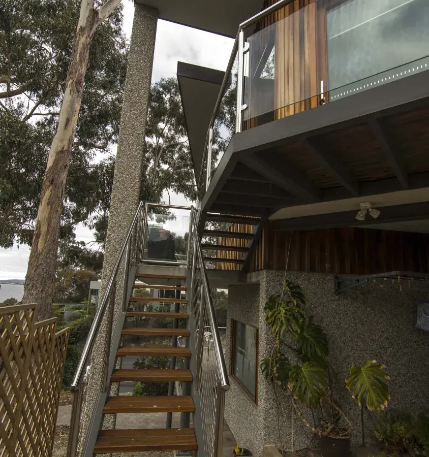 Interesting angles on display in this Blackman's Bay house overlooking the water.
